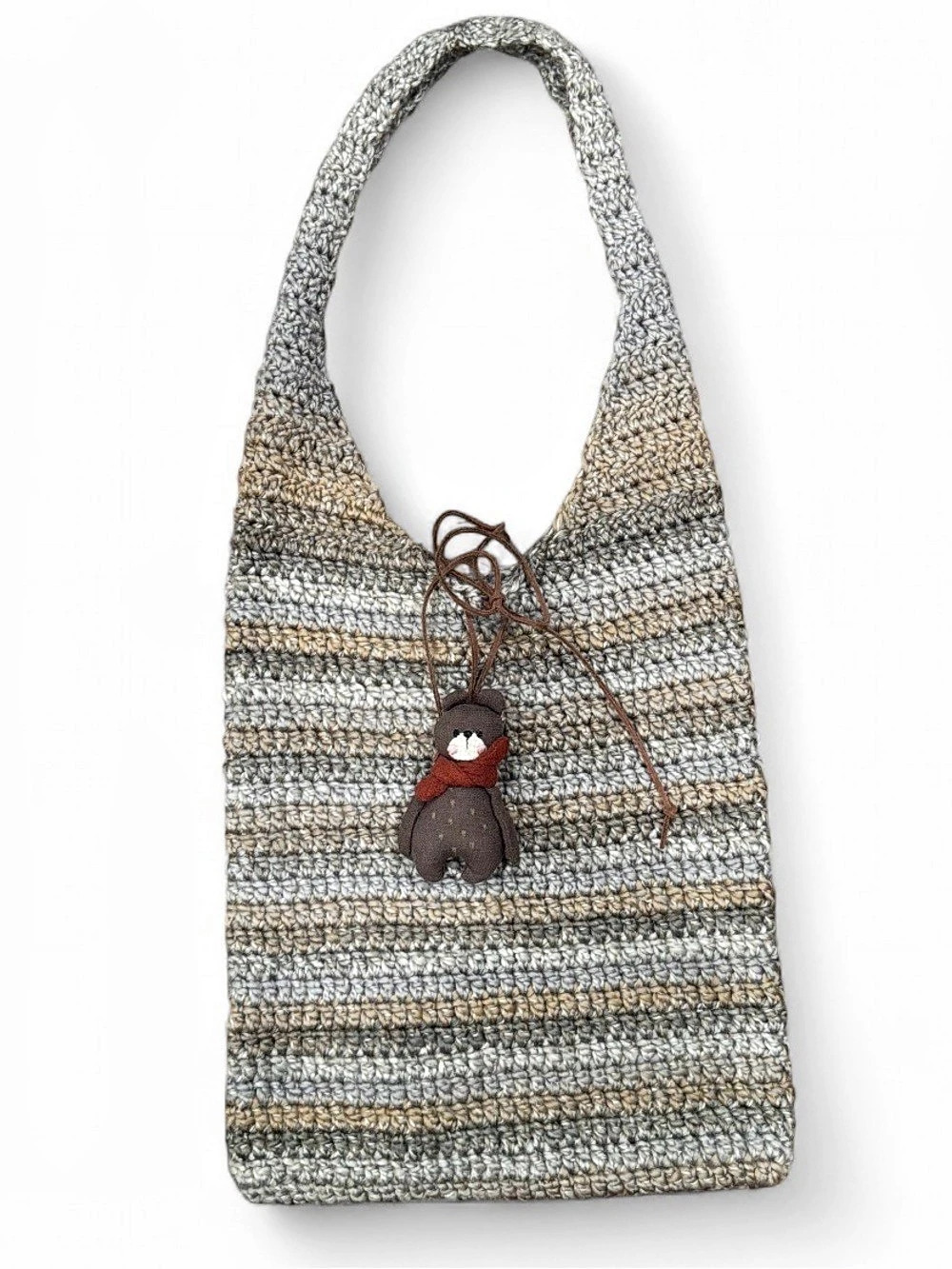Handmade crochet tote bag. Features a cute handmade bear charm.